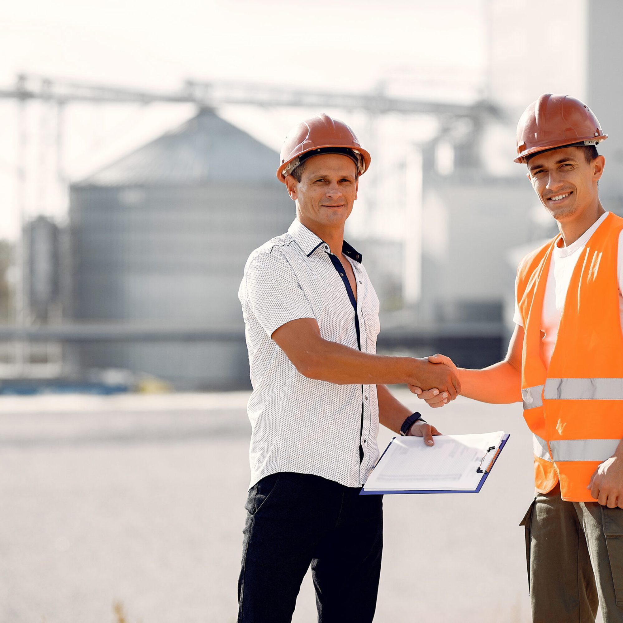 engineers-helmets-standing-by-factory-scaled.jpg